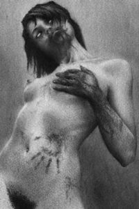 A naked zombie woman grabs one of her breasts with a bloodied hand.