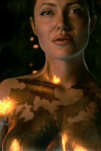Angelina Jolie as Mother, the nude gold-painted dragon woman.